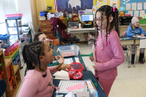  students smiling at each other